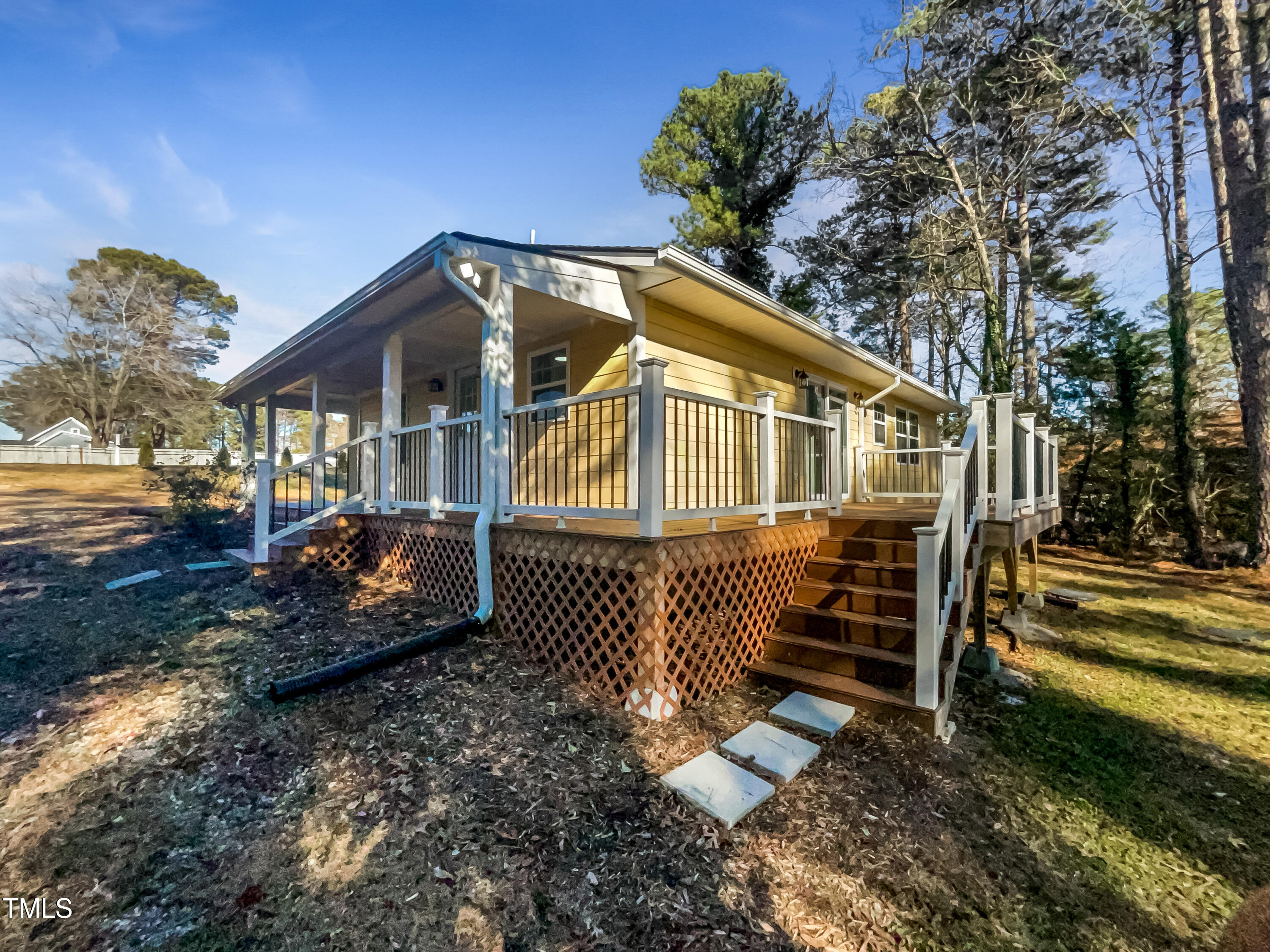 6307 Tryon Road Cary, NC 27518 - Photo 17 of 18 a front view of a house with a yard