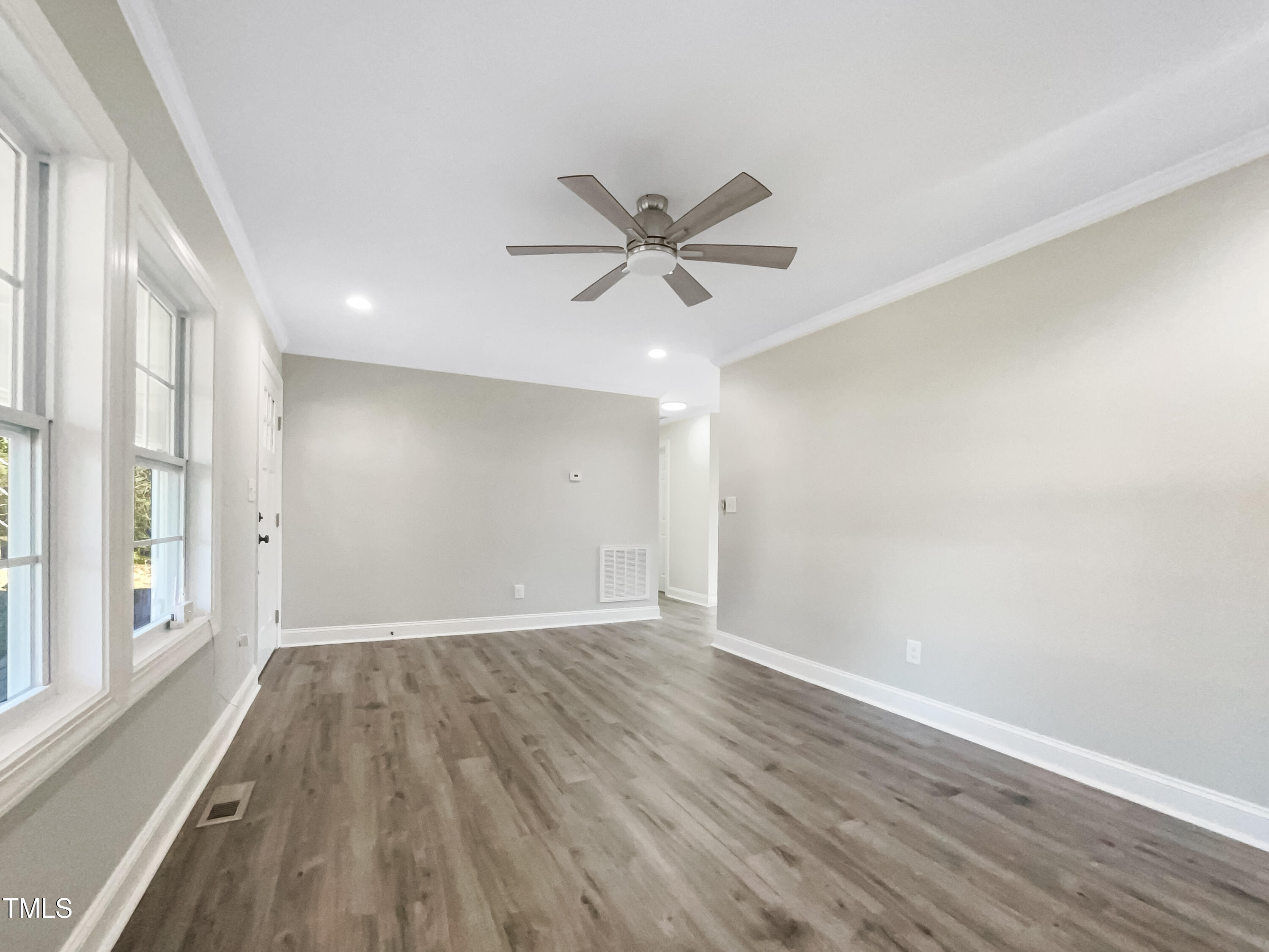 6307 Tryon Road Cary, NC 27518 - Photo 10 of 18 wooden floor in an empty room with a window