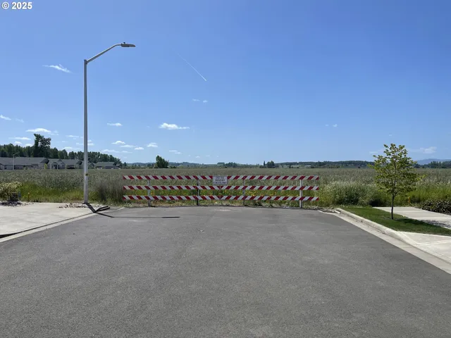 a view of a lake with a building in the background
