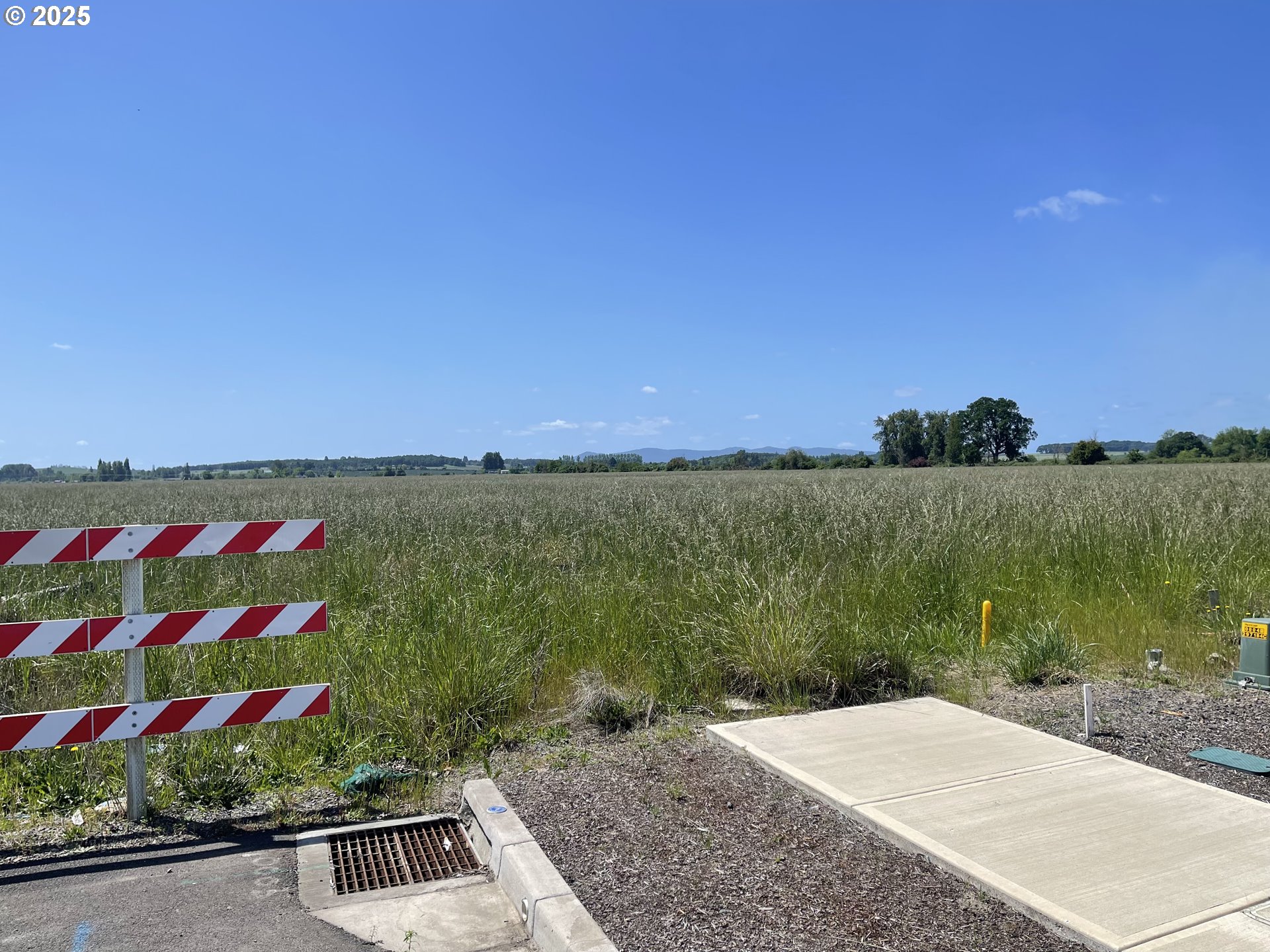 0 Jefferson Street Independence, OR 97351 - Photo 4 of 7 a view of a lake with a building in the background