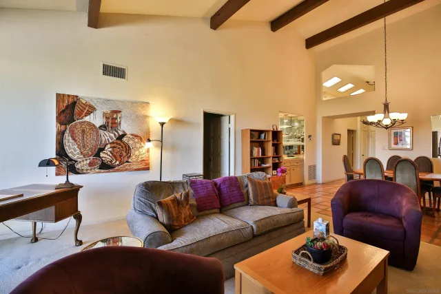 a bedroom with a bed and a night stand