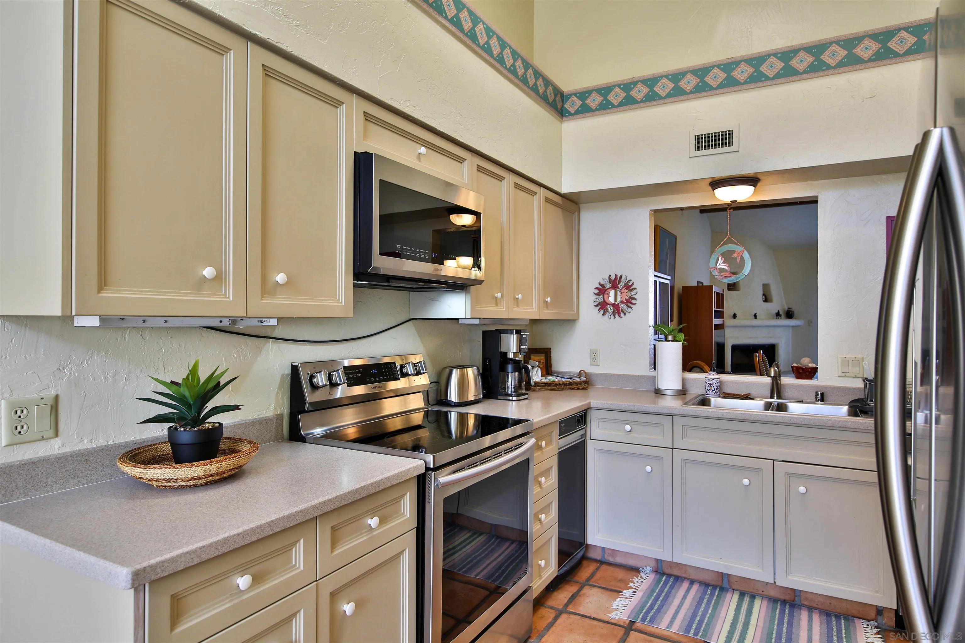 1921 Desert Vista Terrace Borrego Springs, CA 92004 - Photo 4 of 19 a kitchen with stainless steel appliances granite countertop a sink a stove and cabinets