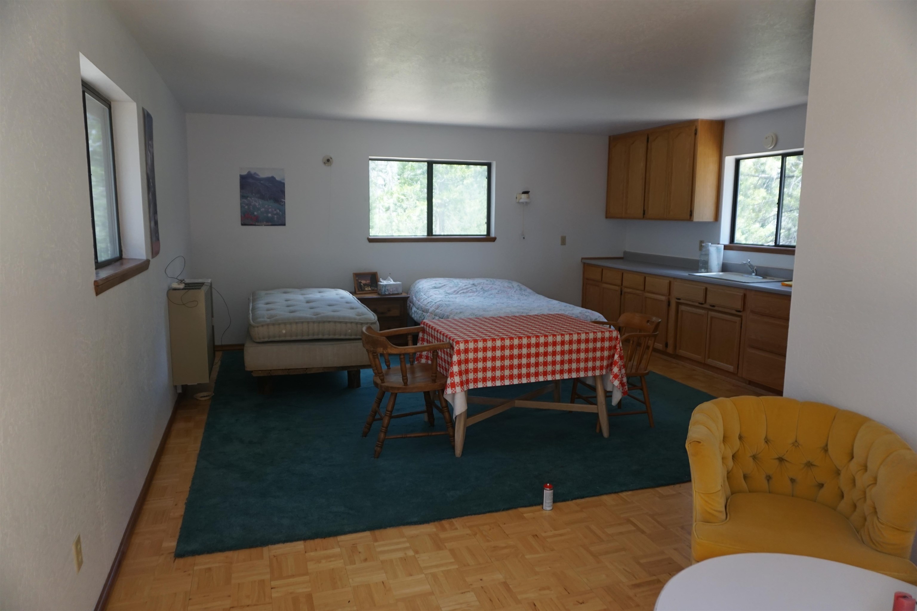 1334 Highlands Road Quincy, CA 95971 - Photo 25 of 47 a bedroom with a bed and a dresser in it