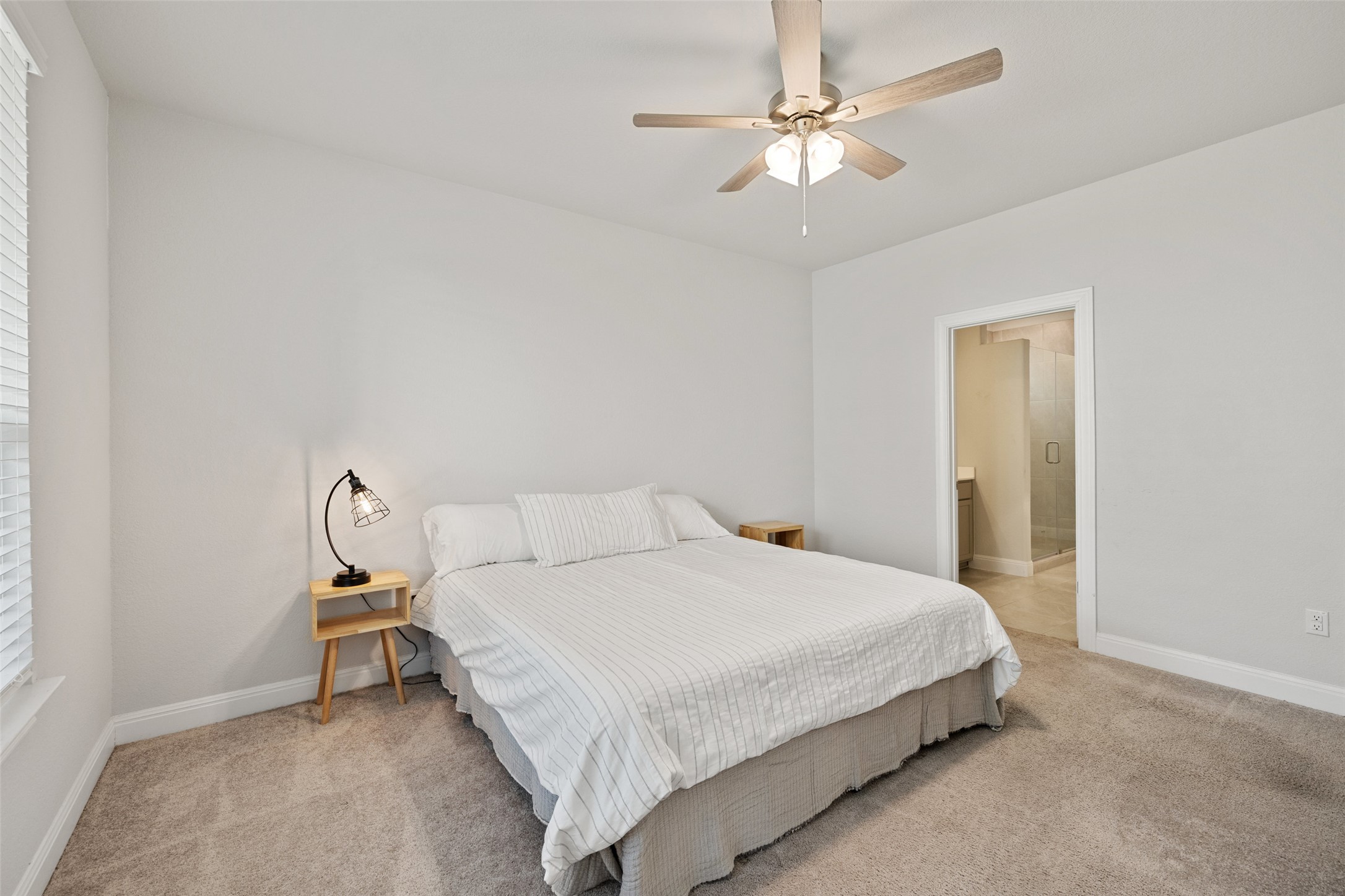 1012 Legend Milton Lane Austin, TX 78748 - Photo 13 of 30 a bedroom with a bed gym equipment and a window