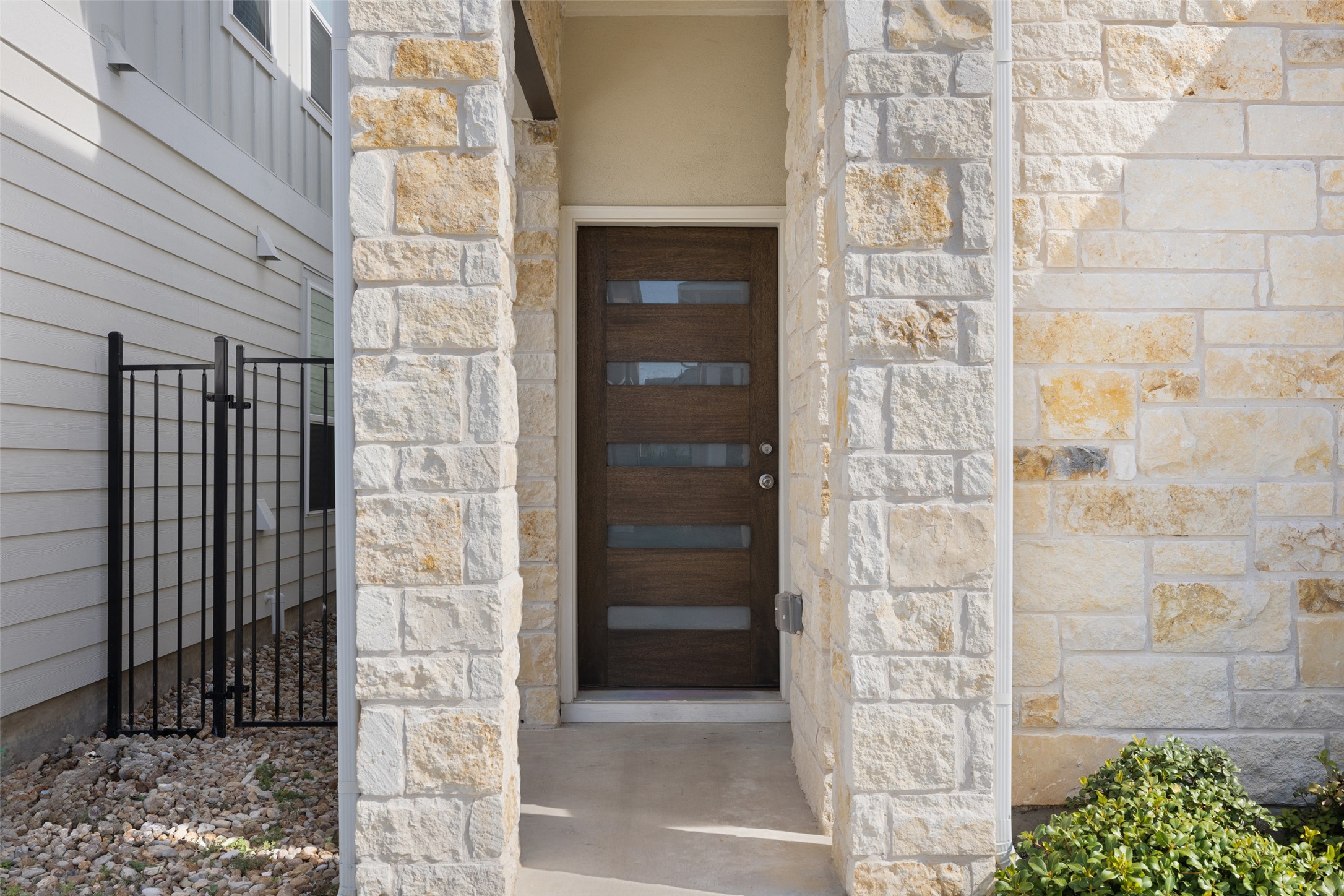 1012 Legend Milton Lane Austin, TX 78748 - Photo 2 of 30 a brick building with a door and a window