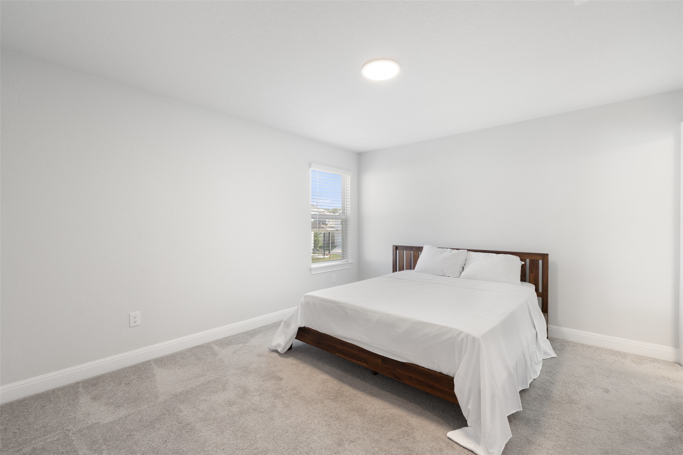 1012 Legend Milton Lane Austin, TX 78748 - Photo 21 of 30 a bedroom with a bed and a window