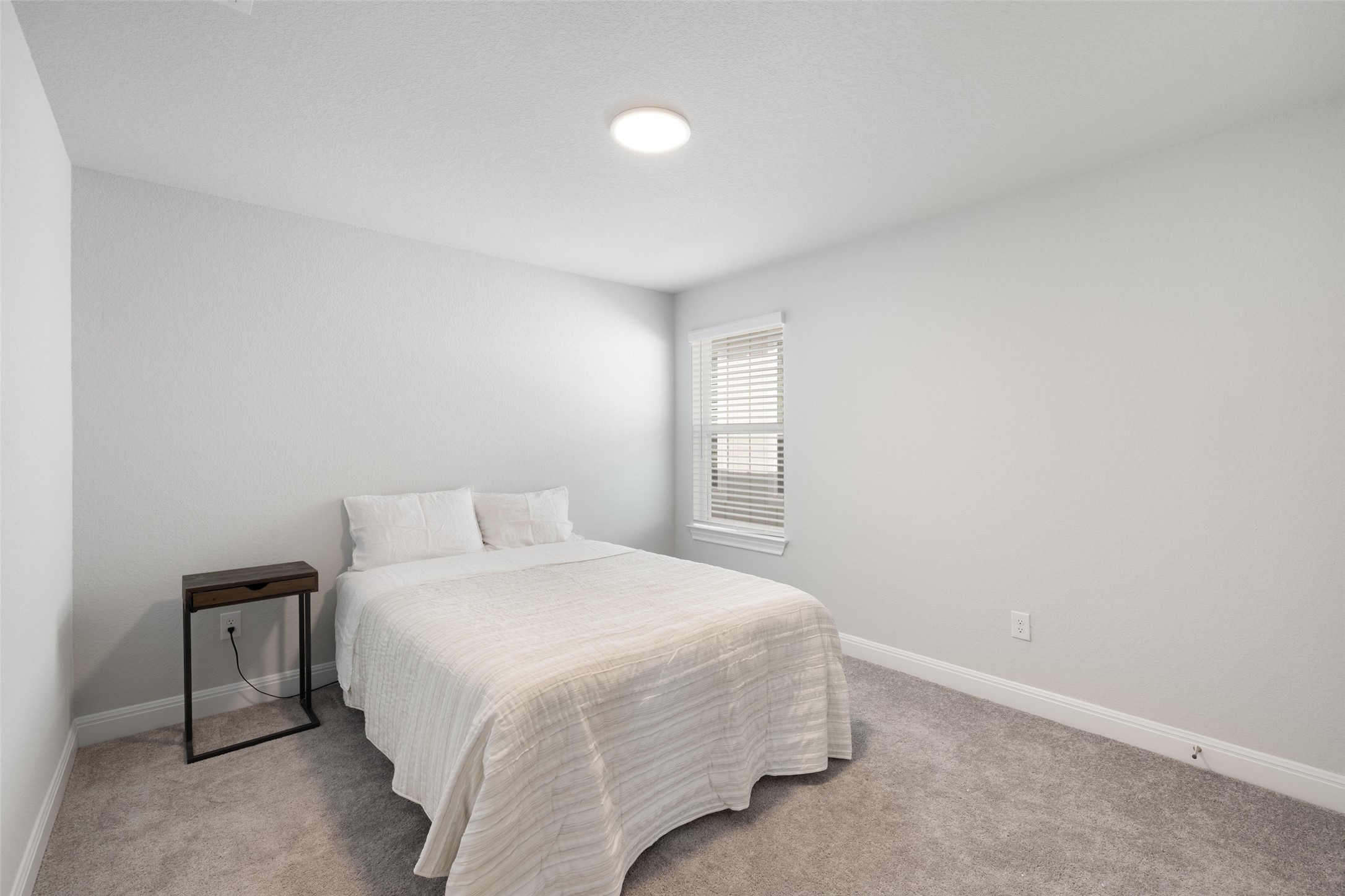 1012 Legend Milton Lane Austin, TX 78748 - Photo 23 of 30 a bedroom with a bed and a window
