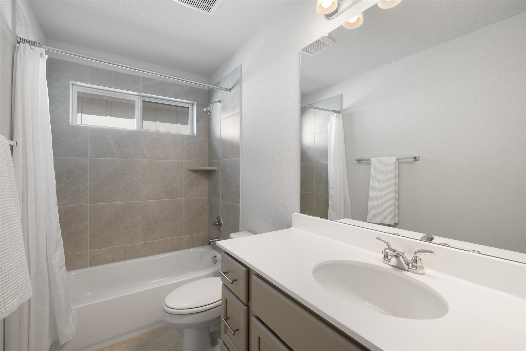 1012 Legend Milton Lane Austin, TX 78748 - Photo 25 of 30 a bathroom with a sink a toilet and shower