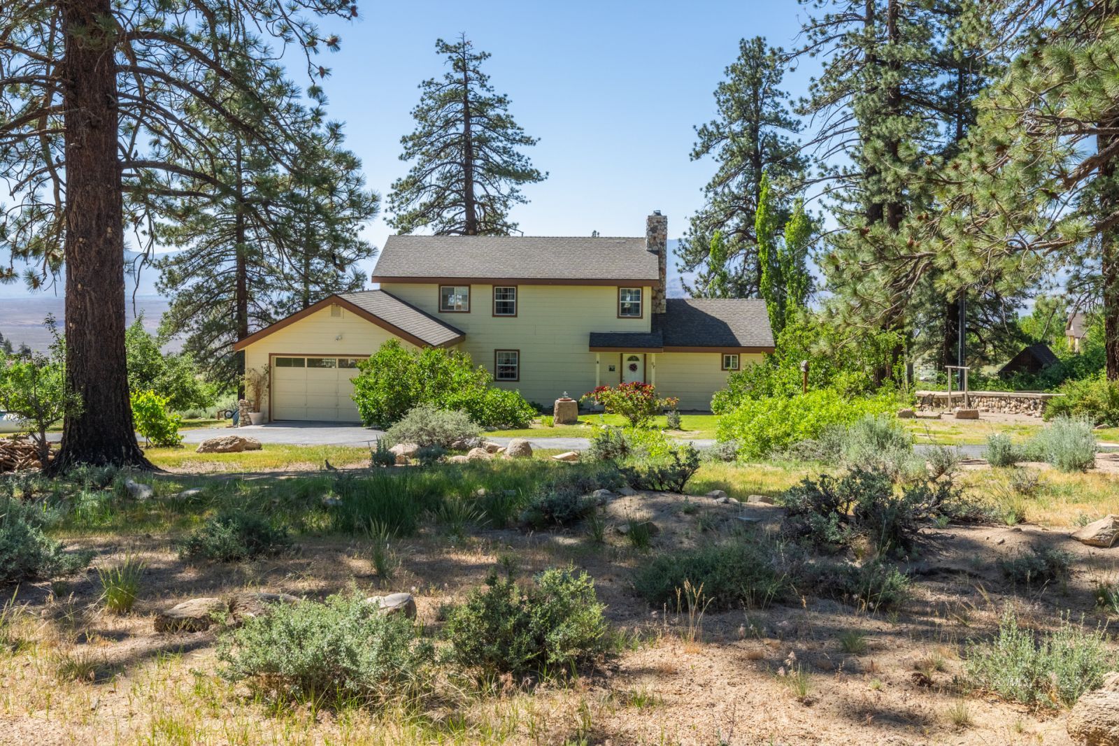 67 Willow Road Swall Meadows, CA 93514 - Photo 1 of 35 a front view of a house with a yard