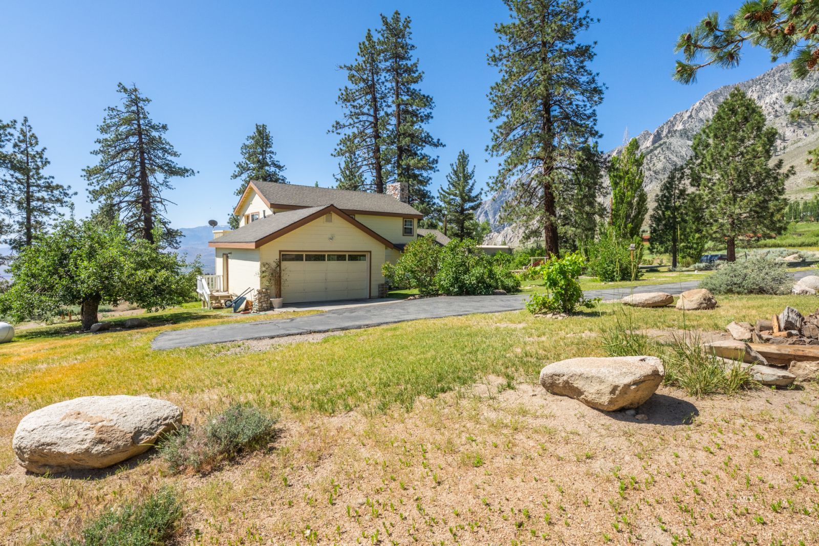 67 Willow Road Swall Meadows, CA 93514 - Photo 31 of 35 a swimming pool with yard and trees in the background