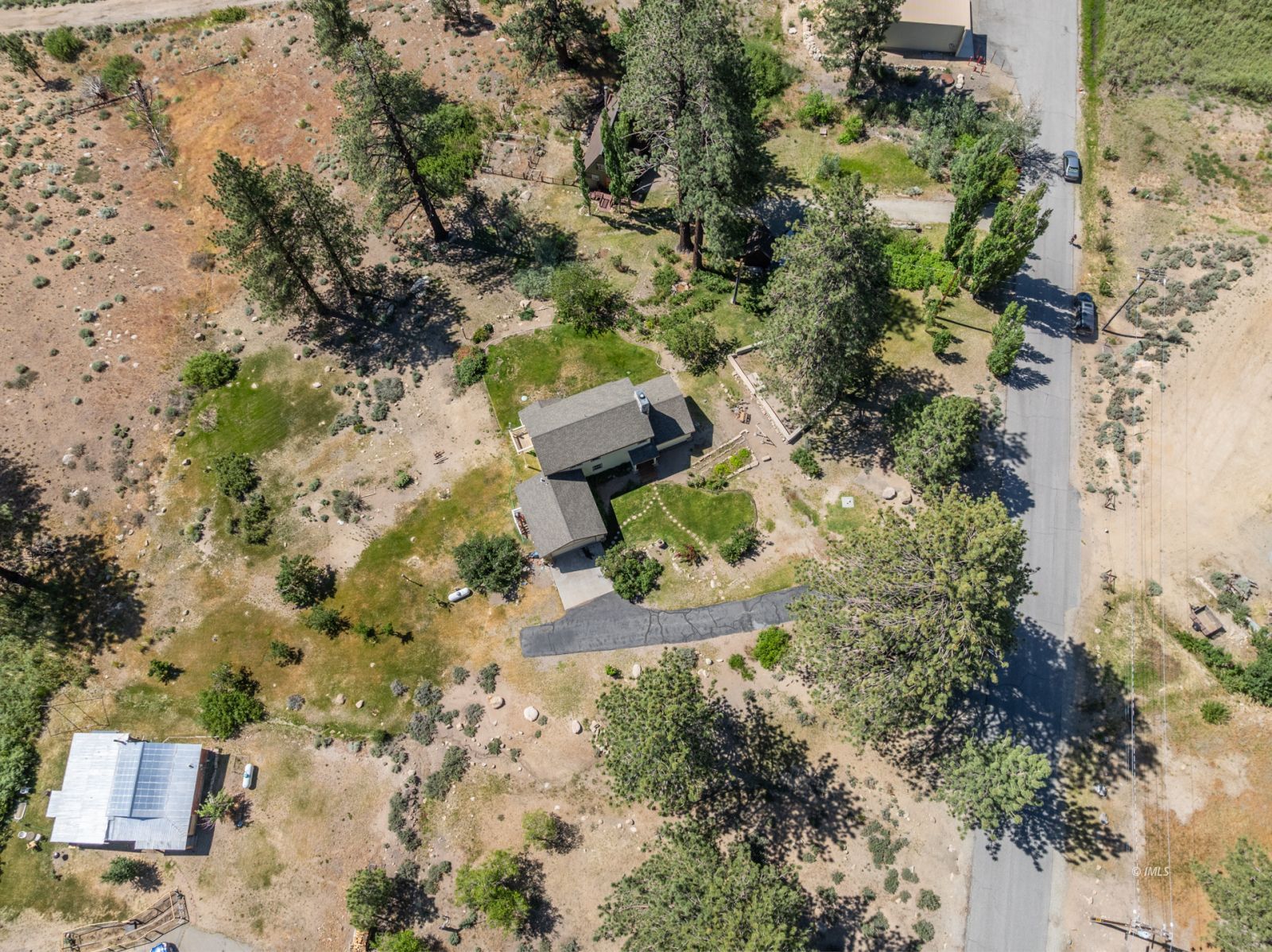 67 Willow Road Swall Meadows, CA 93514 - Photo 33 of 35 an aerial view of a house with a yard