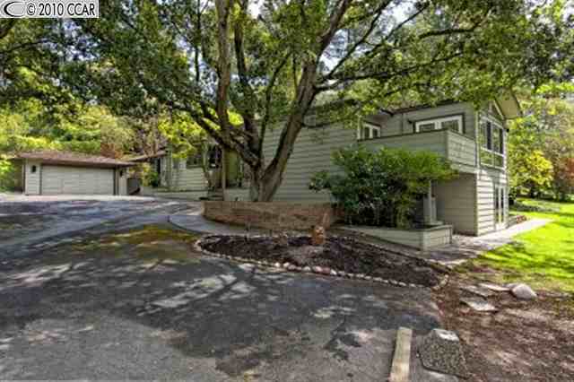 24 Brookside Road Orinda, CA 94563 - Photo 1 of 1 a view of a house with a tree