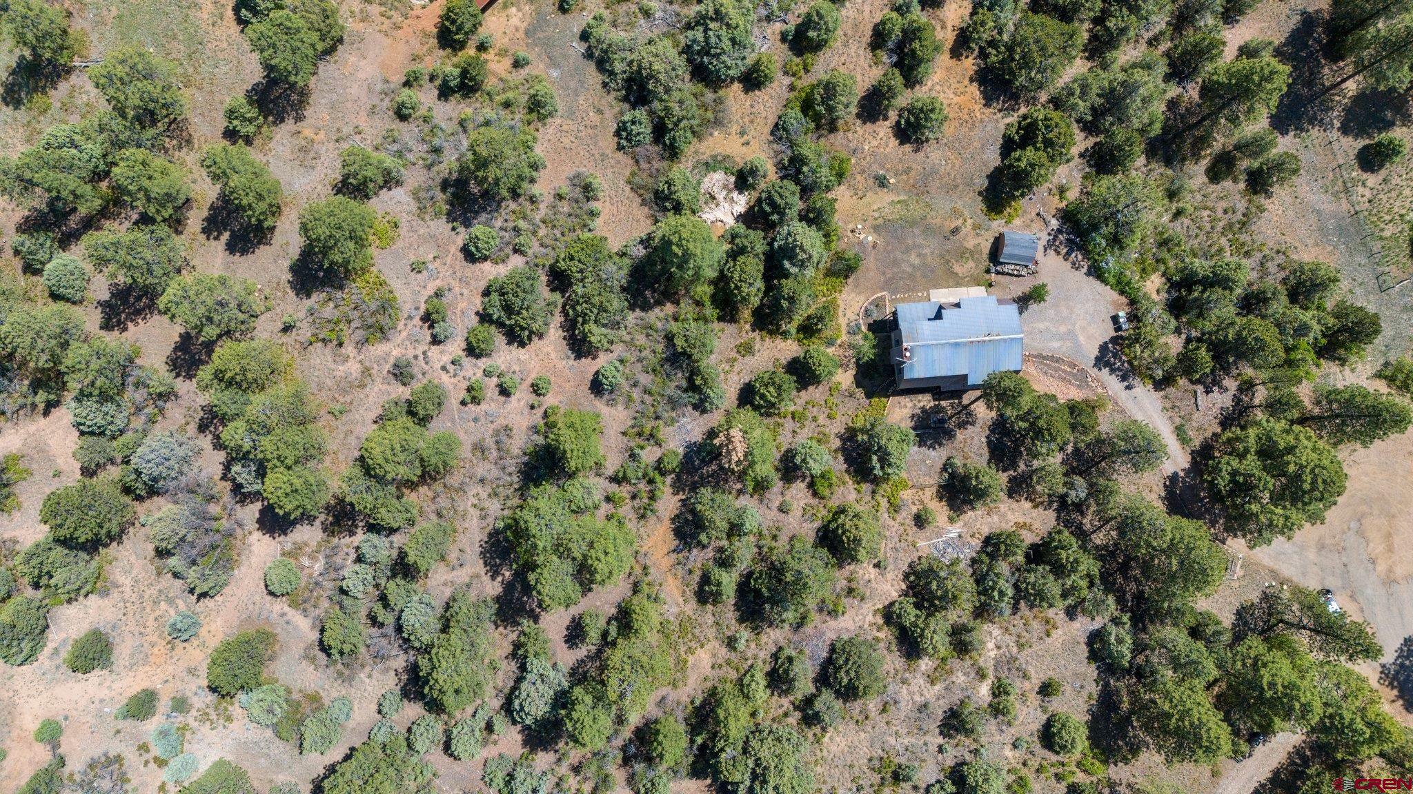 150 Pine Road Durango, CO 81303 - Photo 30 of 35 an aerial view of a house with a yard
