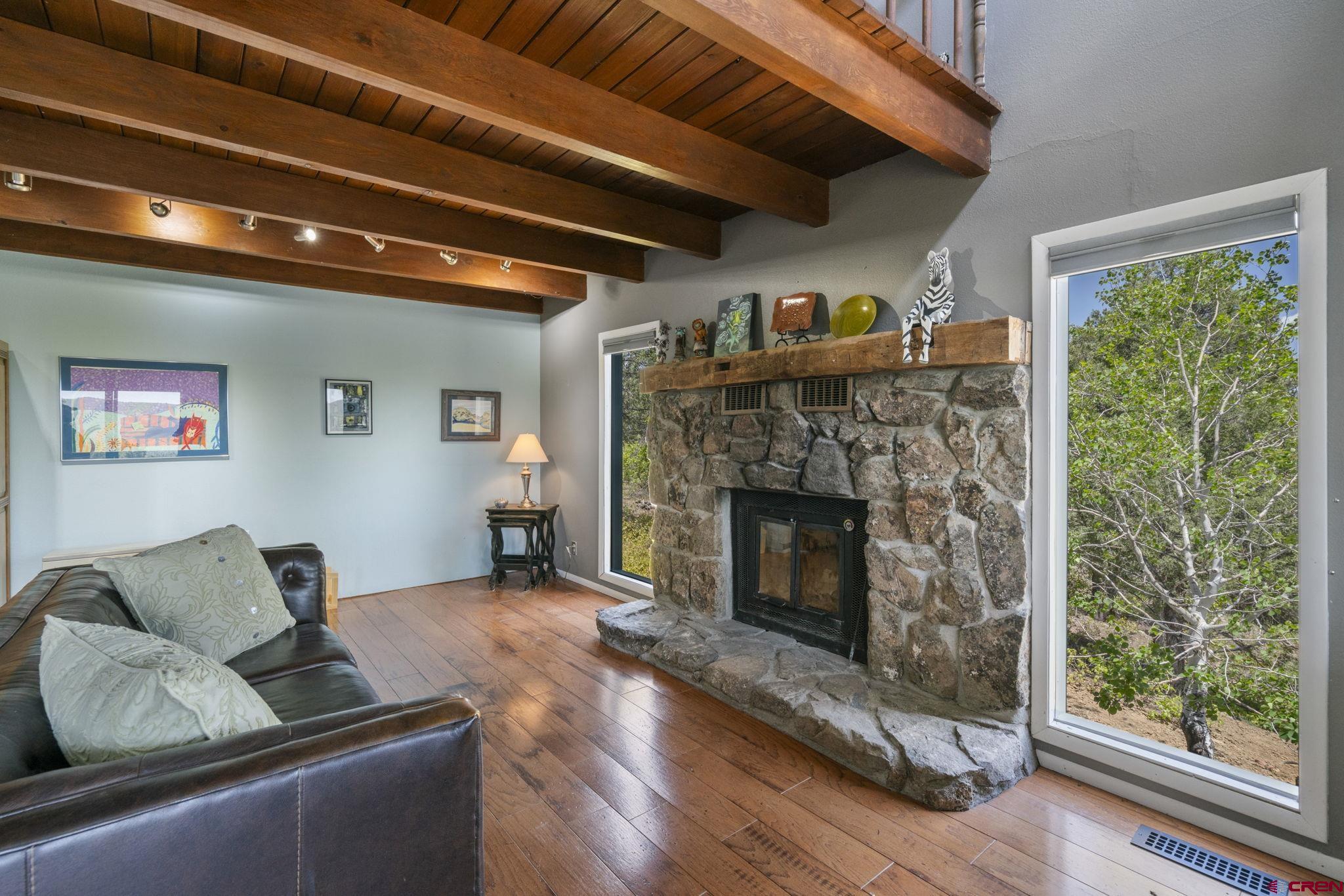 150 Pine Road Durango, CO 81303 - Photo 4 of 35 a living room with furniture and a fireplace