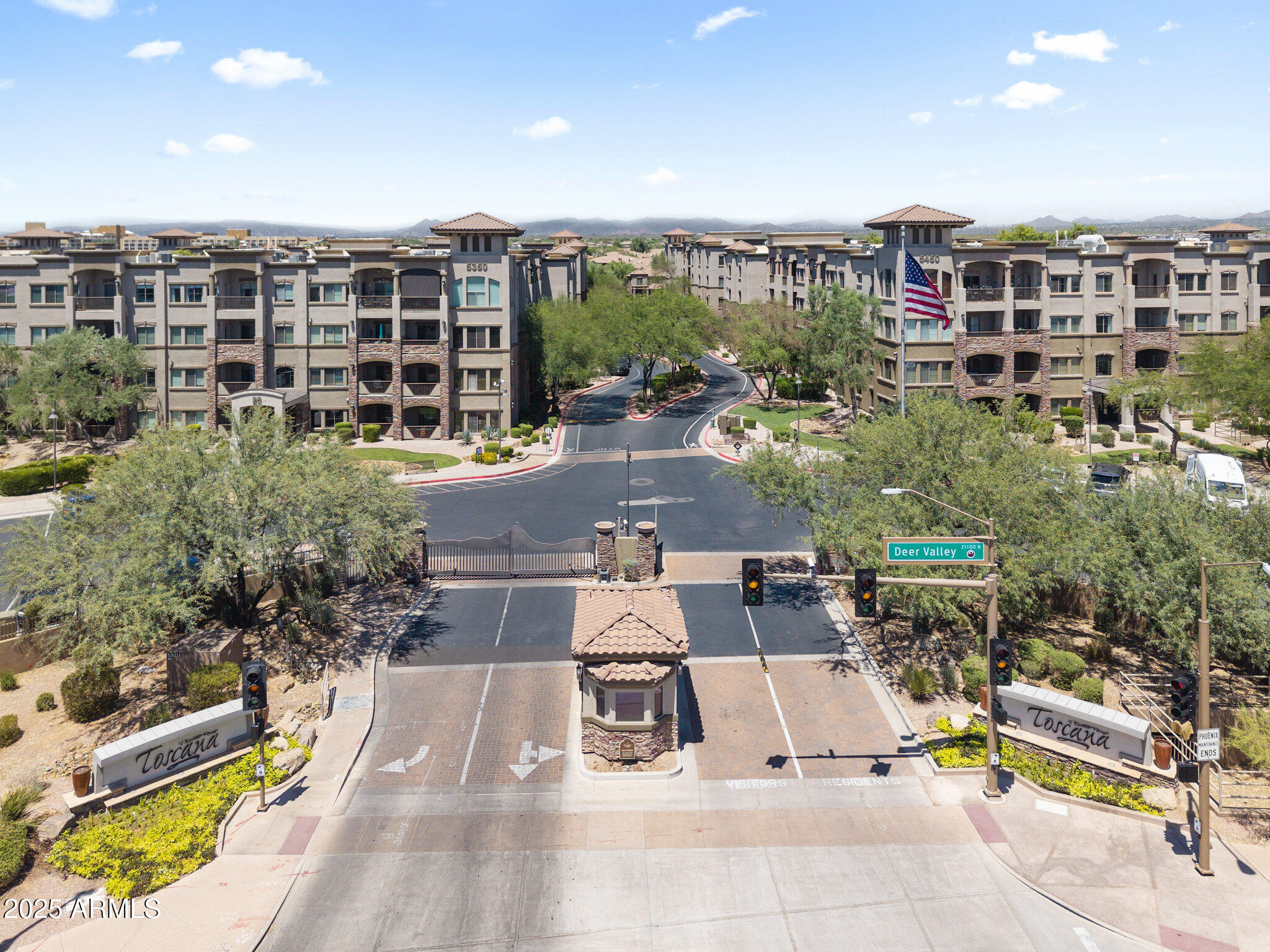 a view of a patio with couches and table and chairs and potted plants