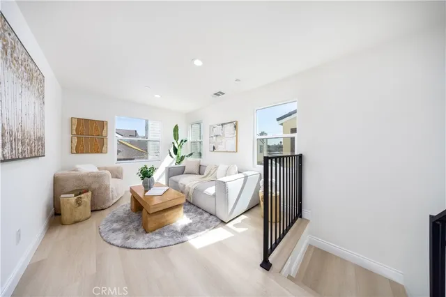 a living room with furniture window and a table
