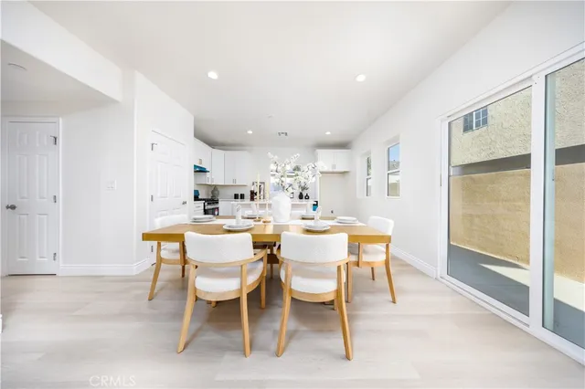 a dining room with a table and chairs
