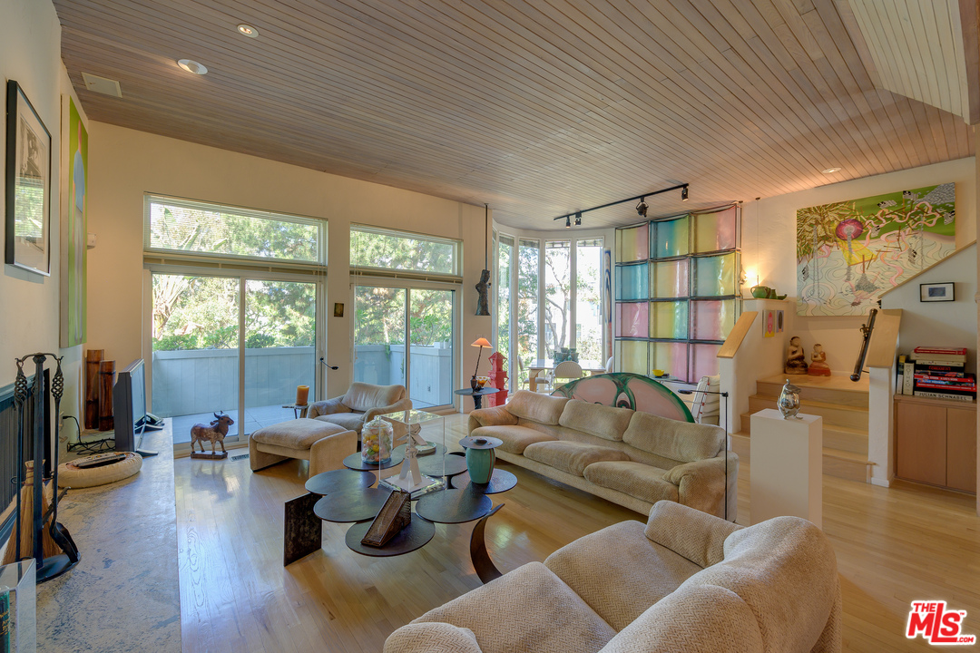 16 Westwind Street Marina del Rey, CA 90292 - Photo 2 of 40 a living room with furniture floor to ceiling window and a flat screen tv