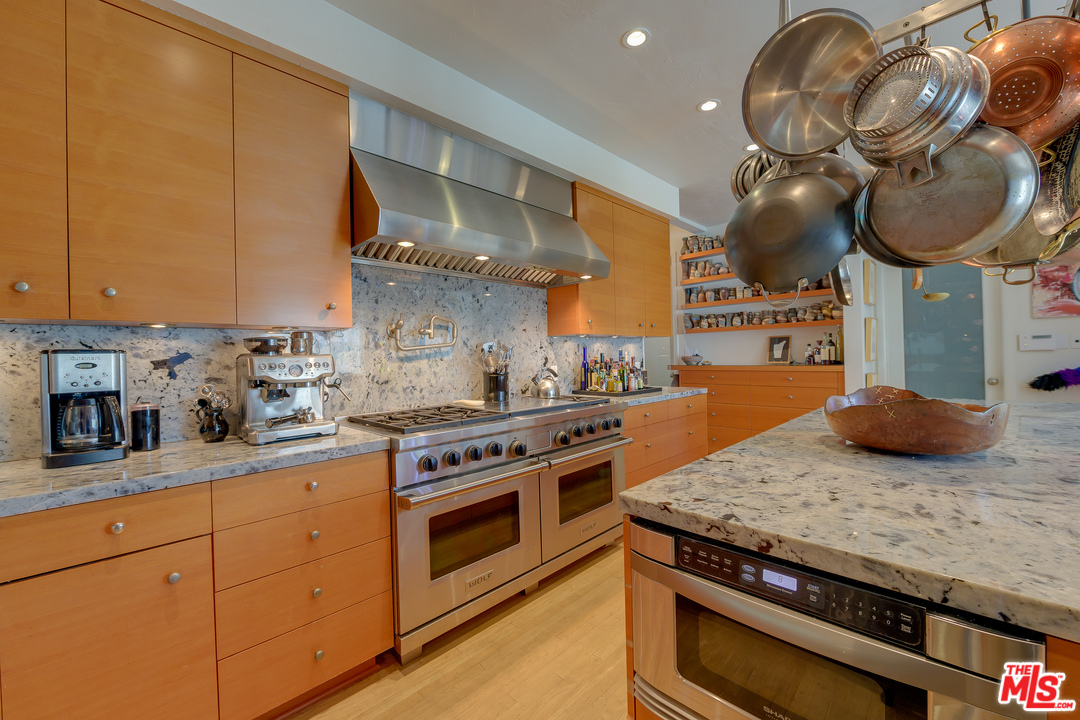 16 Westwind Street Marina del Rey, CA 90292 - Photo 11 of 40 a kitchen with a stove a sink and cabinets
