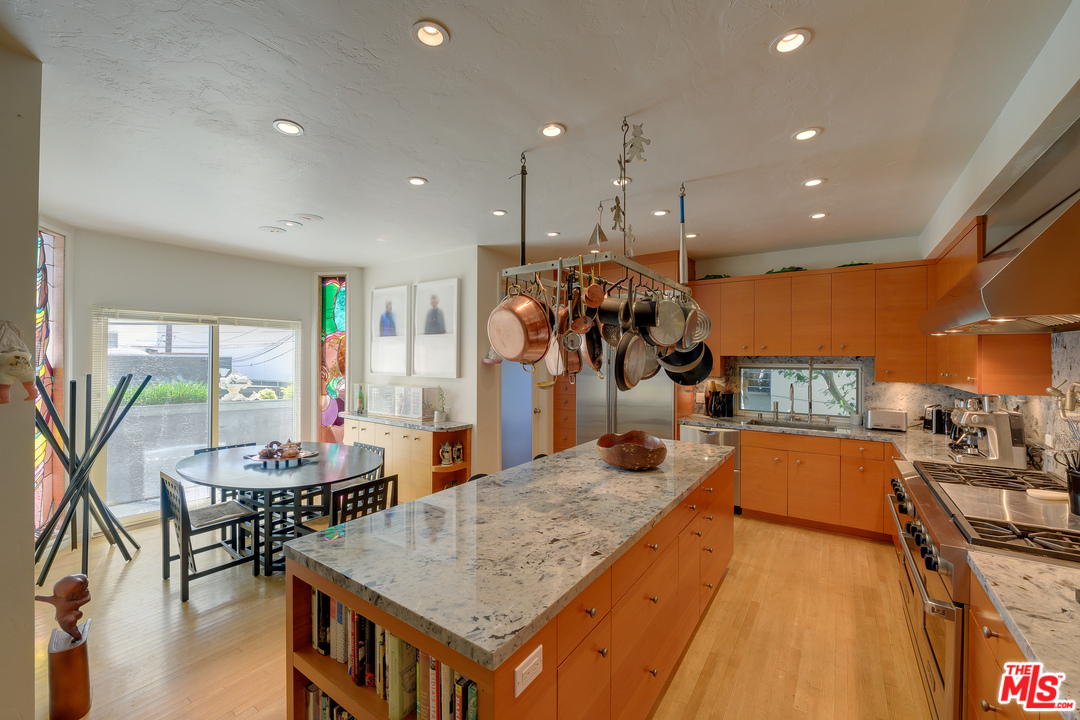 16 Westwind Street Marina del Rey, CA 90292 - Photo 13 of 40 a very nice looking dining room with kitchen island furniture a sink a rug and a chandelier