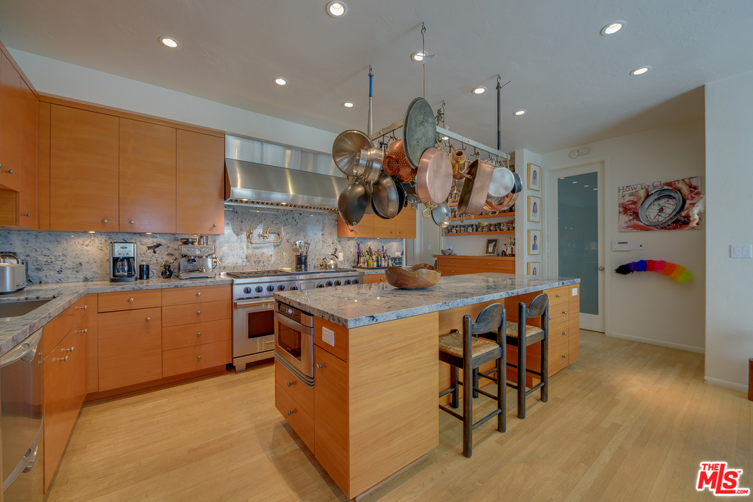 16 Westwind Street Marina del Rey, CA 90292 - Photo 14 of 40 a kitchen with stainless steel appliances granite countertop a stove and a refrigerator