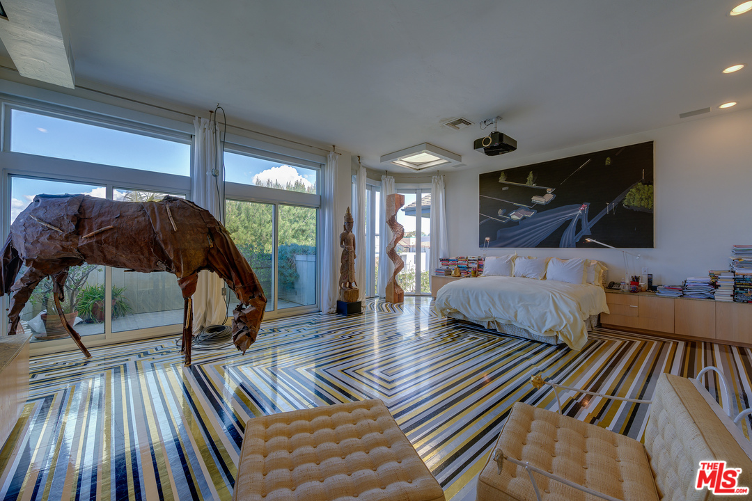 16 Westwind Street Marina del Rey, CA 90292 - Photo 16 of 40 a bedroom with a bed and wooden floor