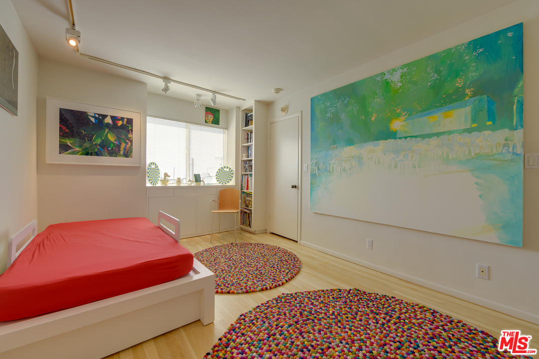 16 Westwind Street Marina del Rey, CA 90292 - Photo 22 of 40 a bedroom with a bed and a window with chair