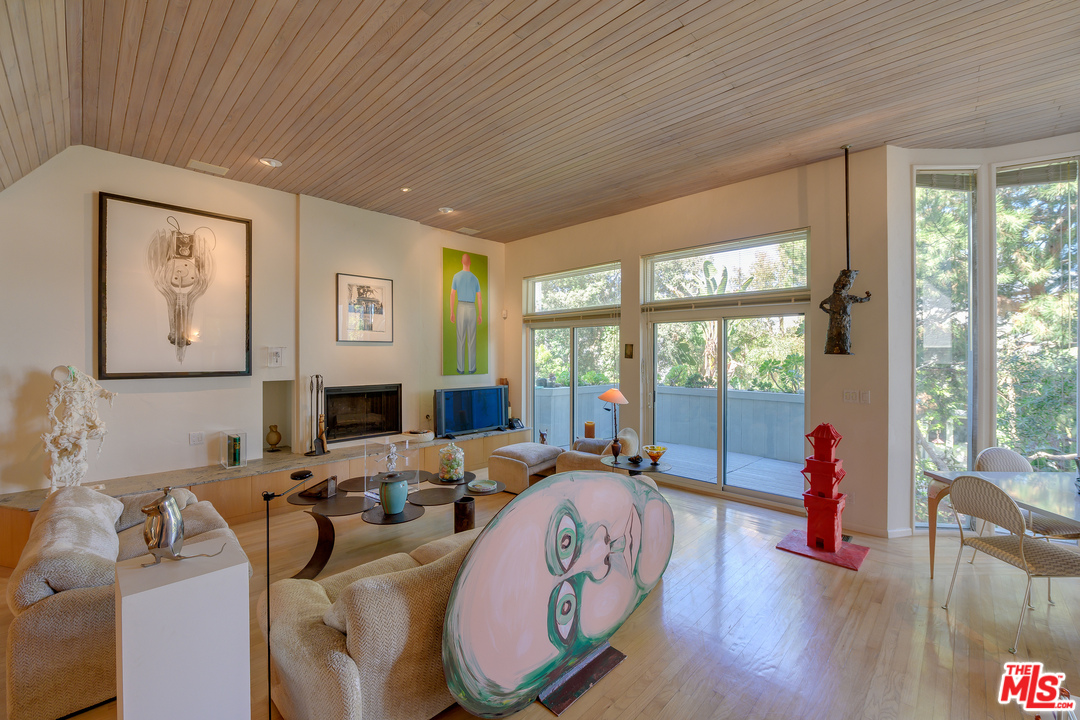 16 Westwind Street Marina del Rey, CA 90292 - Photo 4 of 40 a living room with furniture large window and wooden floor