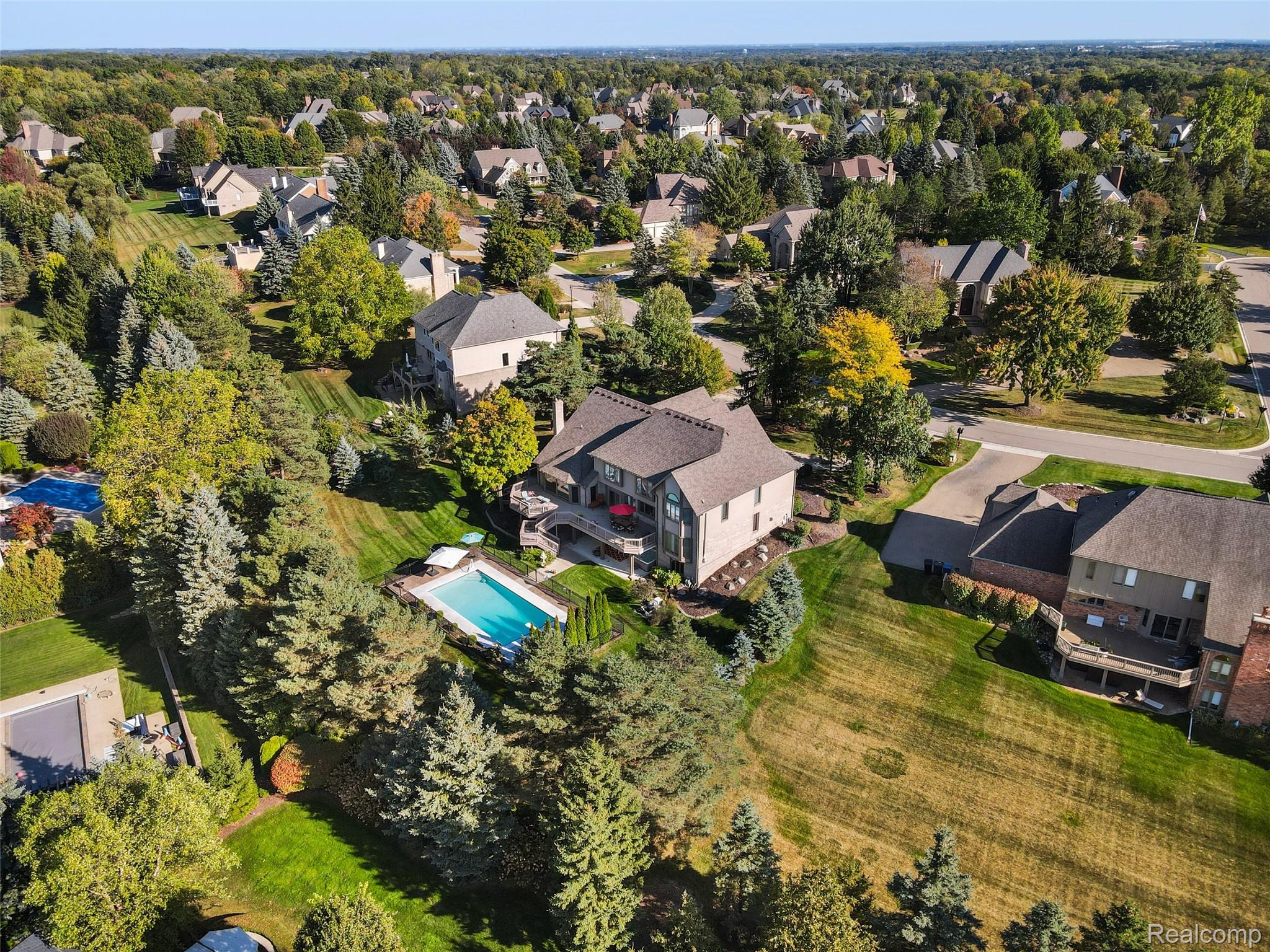 5724 Murfield Drive Rochester, MI 48306 - Photo 12 of 99 Aerial view of residential area with a pool