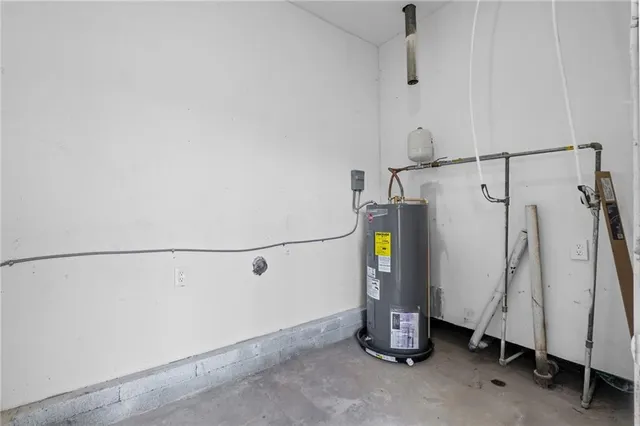 a view of storage and utility room with a utility room