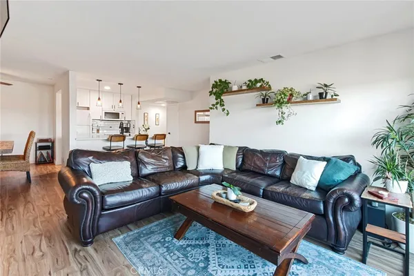 a view of balcony with furniture and city view