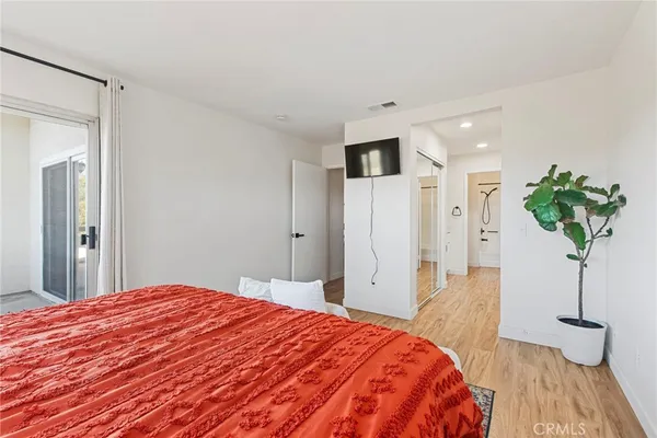a bathroom with a shower sink and mirror