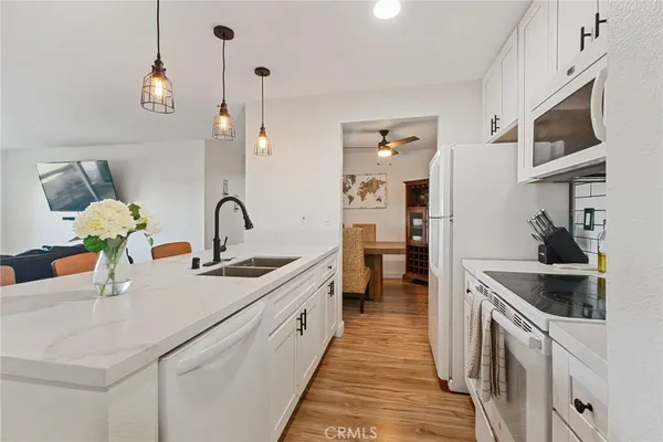 a view of kitchen with furniture and wooden floor