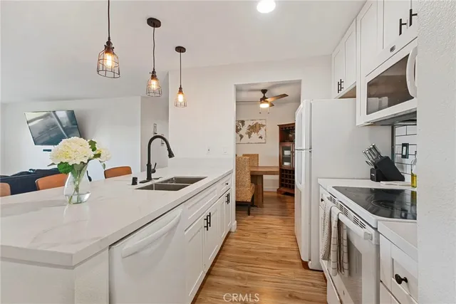 a view of kitchen with furniture and wooden floor