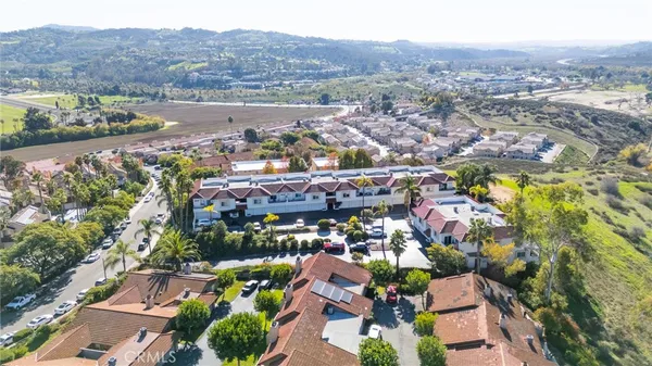 a view of a garden with mountains