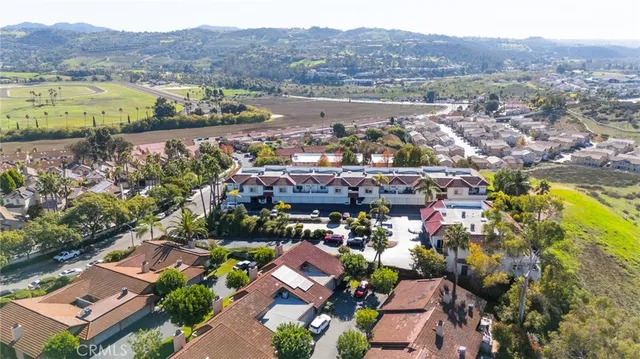 a view of a garden with mountains in the background