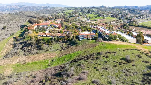 an aerial view of residential house with outdoor space
