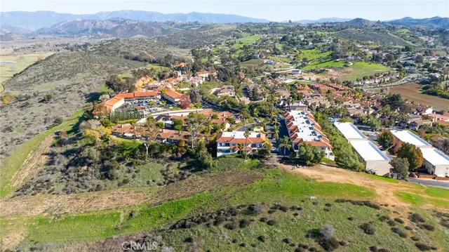 an aerial view of residential houses and street