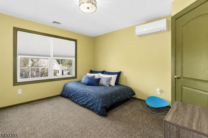 33 Stanton Street Clark, NJ 07066 - Photo 28 of 37 a bedroom with a bed and a painting on the wall