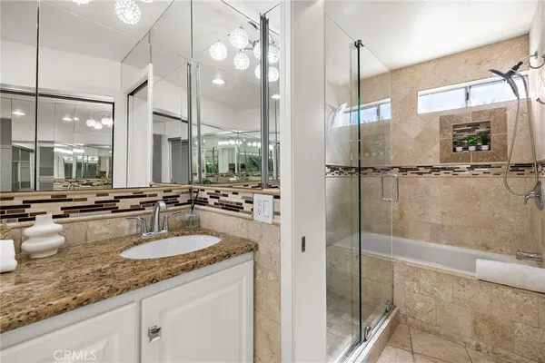 a bathroom with a double vanity sink and mirror