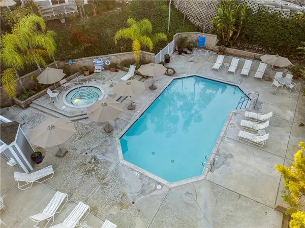 an aerial view of a backyard with garden and outdoor space