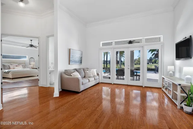a kitchen that has a lot of cabinets in it and wooden floor