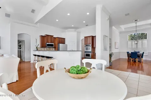 a kitchen with stainless steel appliances granite countertop a stove a sink dishwasher and a refrigerator