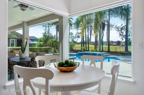 a kitchen with stainless steel appliances granite countertop a sink and a refrigerator