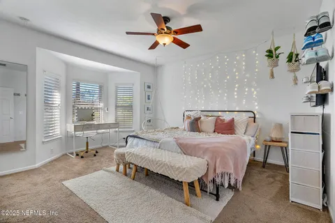 a spacious bathroom with a granite countertop sink a toilet and shower