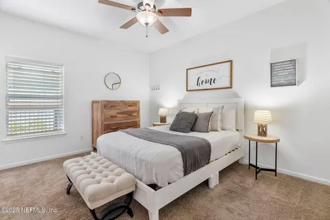 a view of a dining room with furniture wooden floor and chandelier