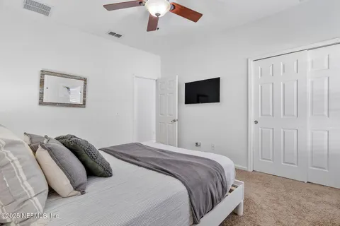 a view of swimming pool with chairs and table and chairs