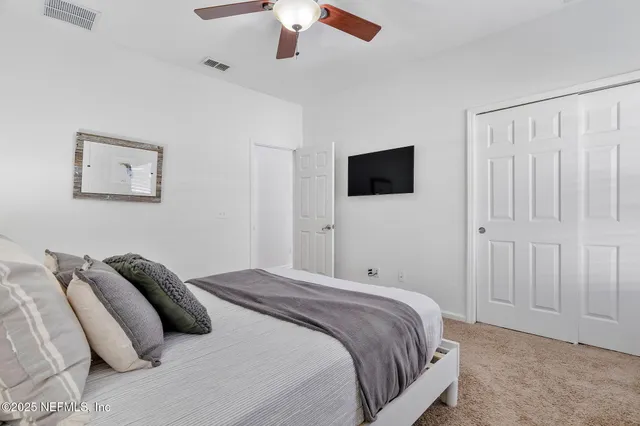 a view of swimming pool with chairs and table and chairs