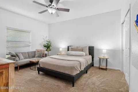 a view of a backyard with palm trees