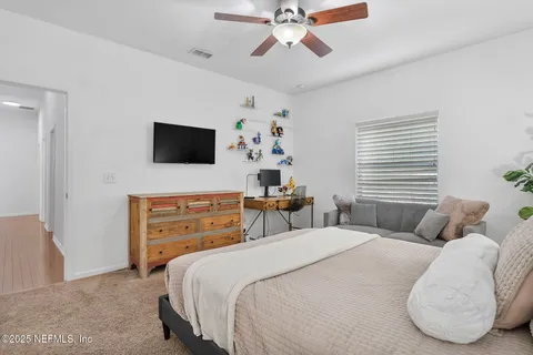 a view of a house with swimming pool and sitting area